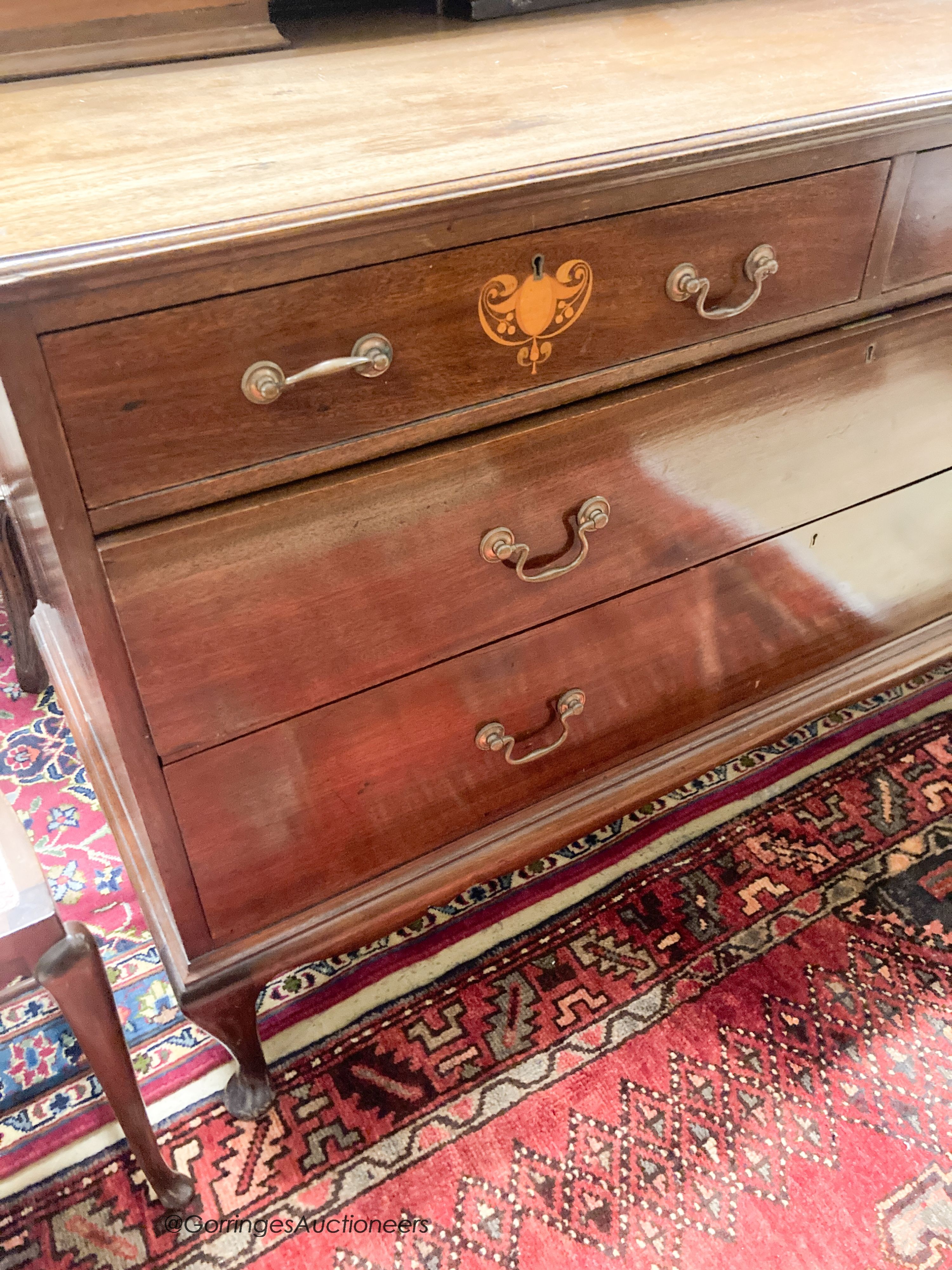 An Edwardian Art Nouveau inlaid mahogany dressing chest, width 122cm, depth 55cm, height 160cm